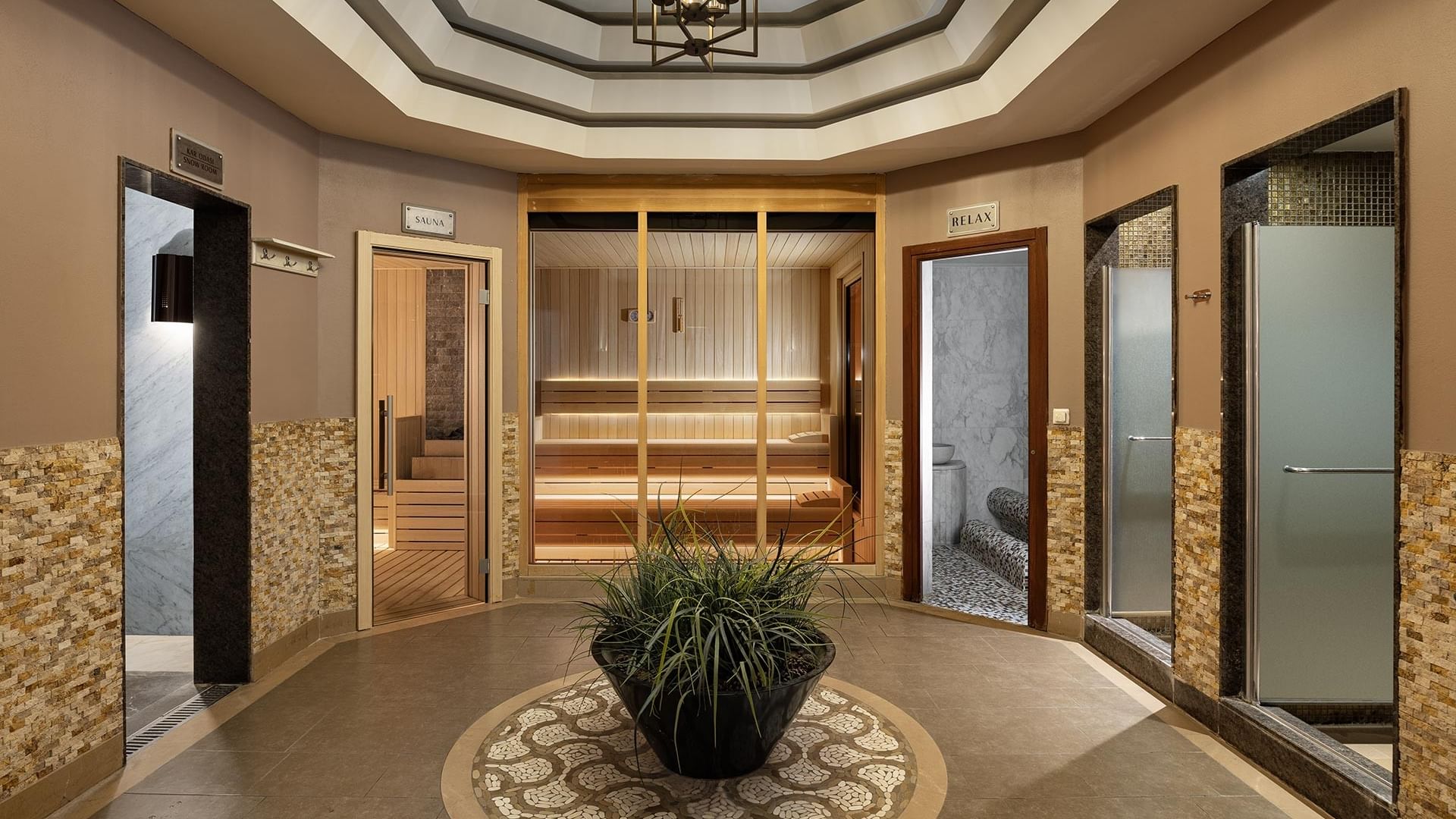 Spa entrance with steam room, sauna, and relaxation area at Titanic Business Kartal in Istanbul.