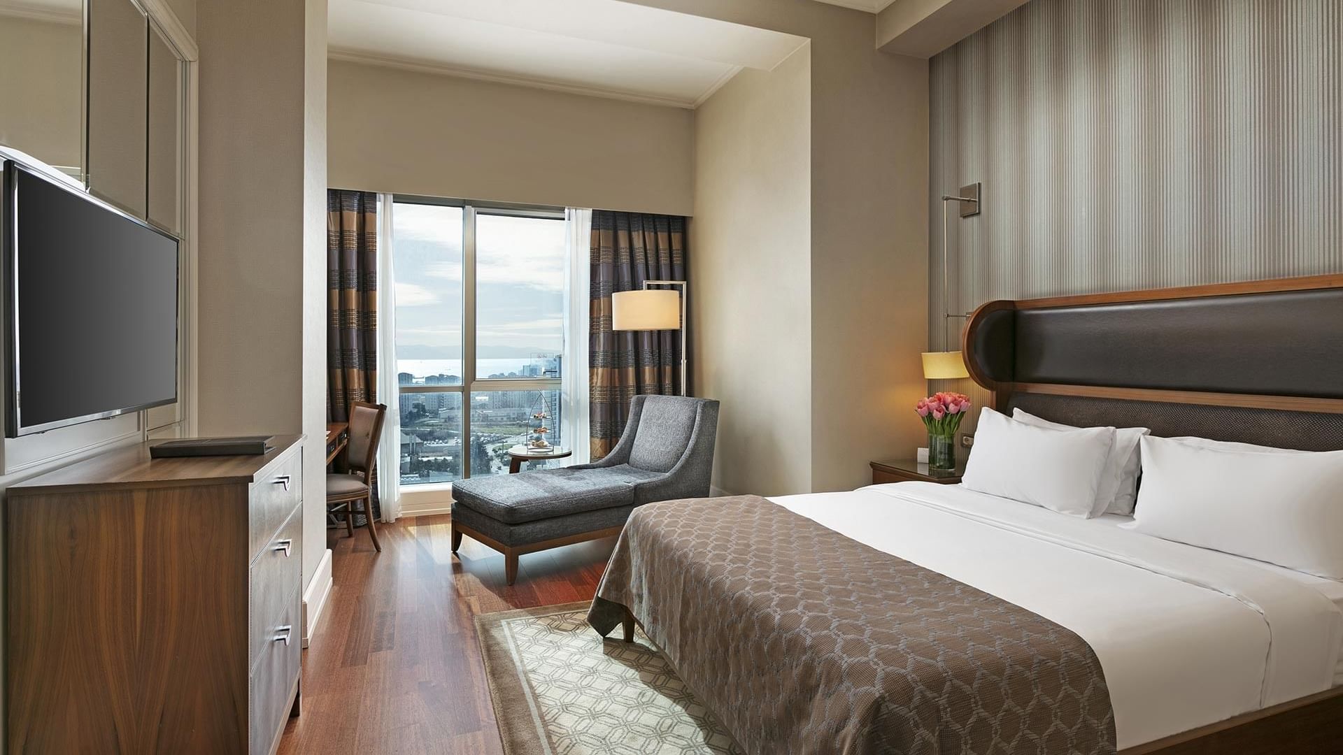 A large Superior Room with city view at Titanic Business Kartal in Istanbul.
