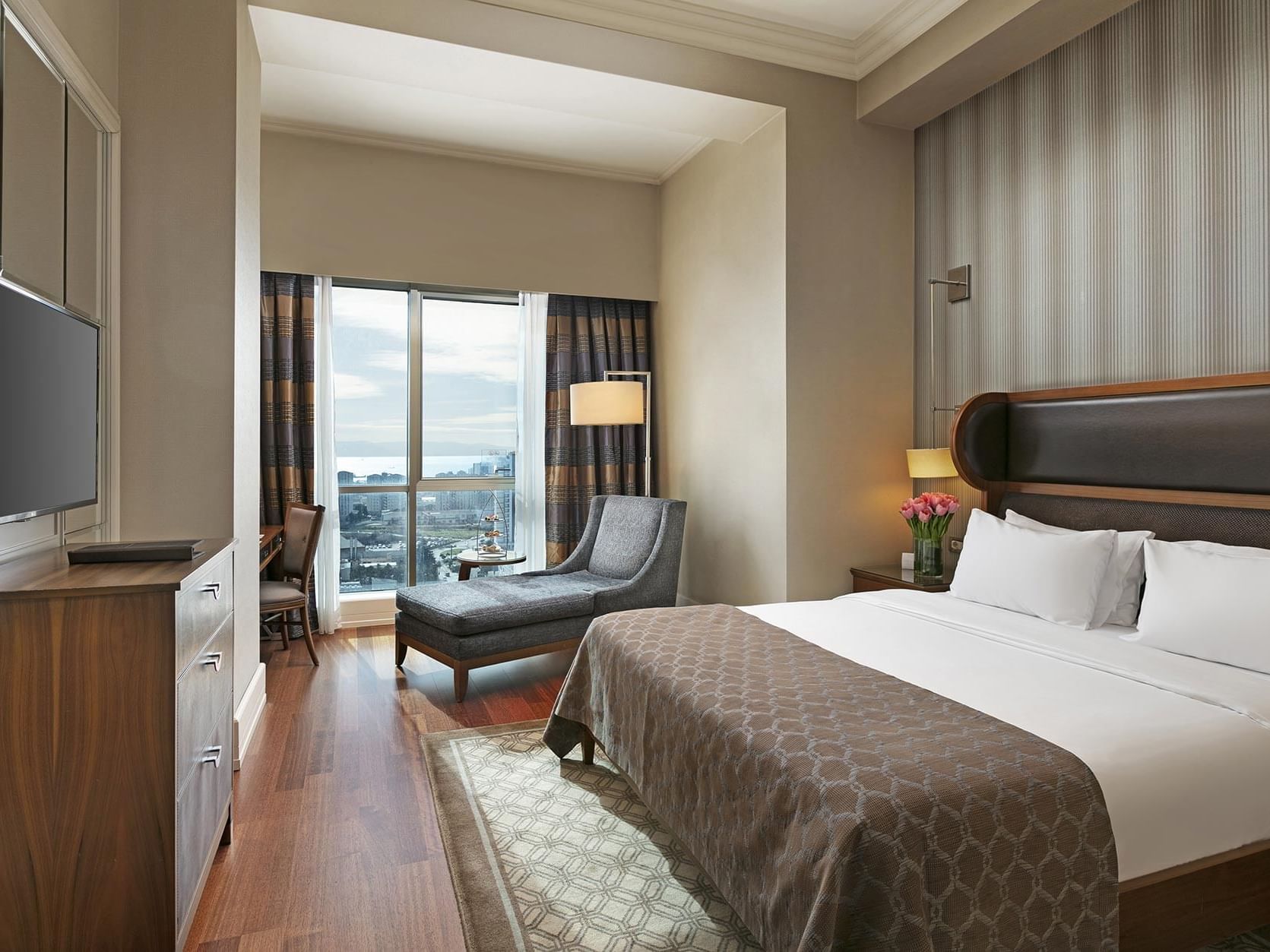 A large Superior Room with city view at Titanic Business Kartal in Istanbul.