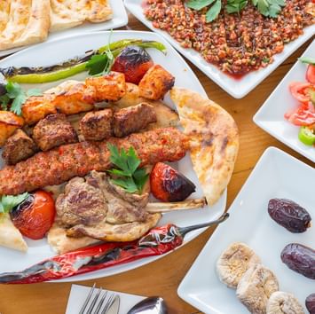 Kebab dishes served on a table in a restaurant near Titanic Business Kartal