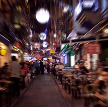 People walking in the downtown markets at night near Titanic Business Kartal