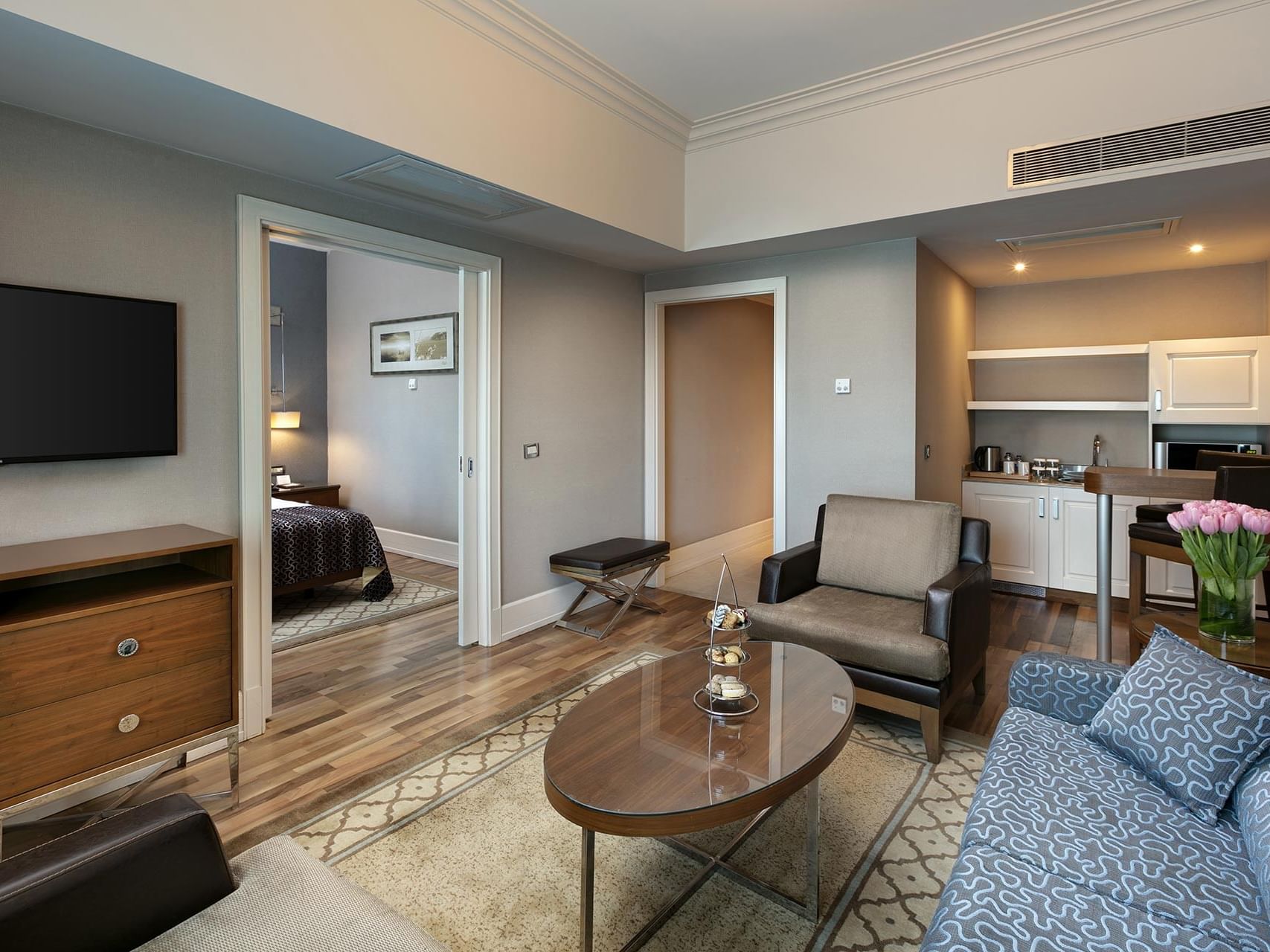 Elegant Club Suite with modern furnishings and kitchen at Titanic Business Kartal in Istanbul.