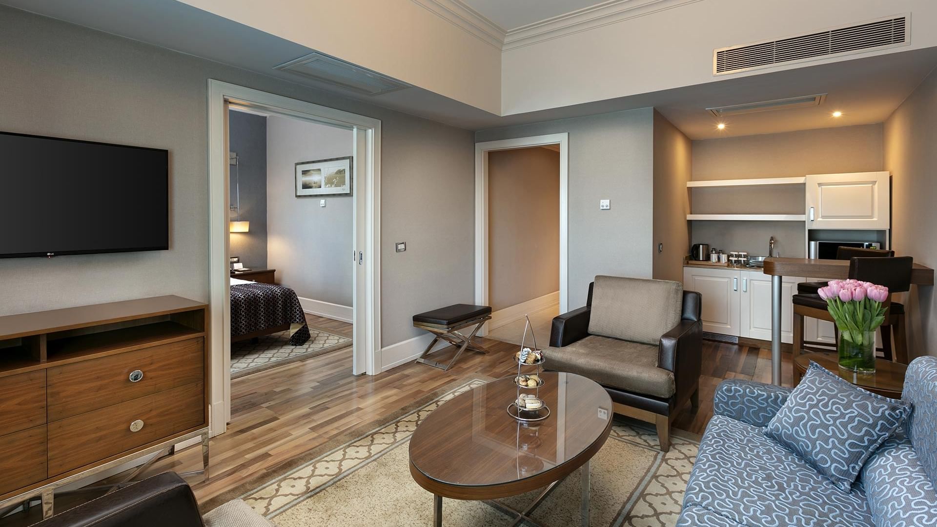 Elegant Club Suite with modern furnishings and kitchen at Titanic Business Kartal in Istanbul.
