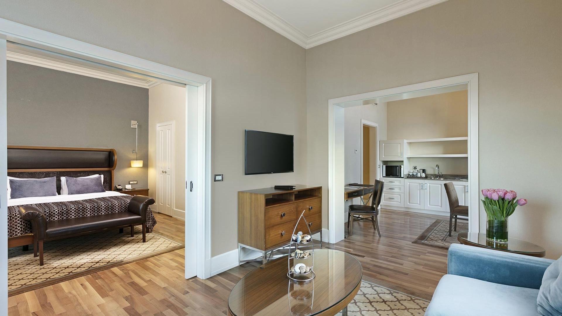 Premier Suite with a living area, bedroom, and kitchenette at Titanic Business Kartal in Istanbul.