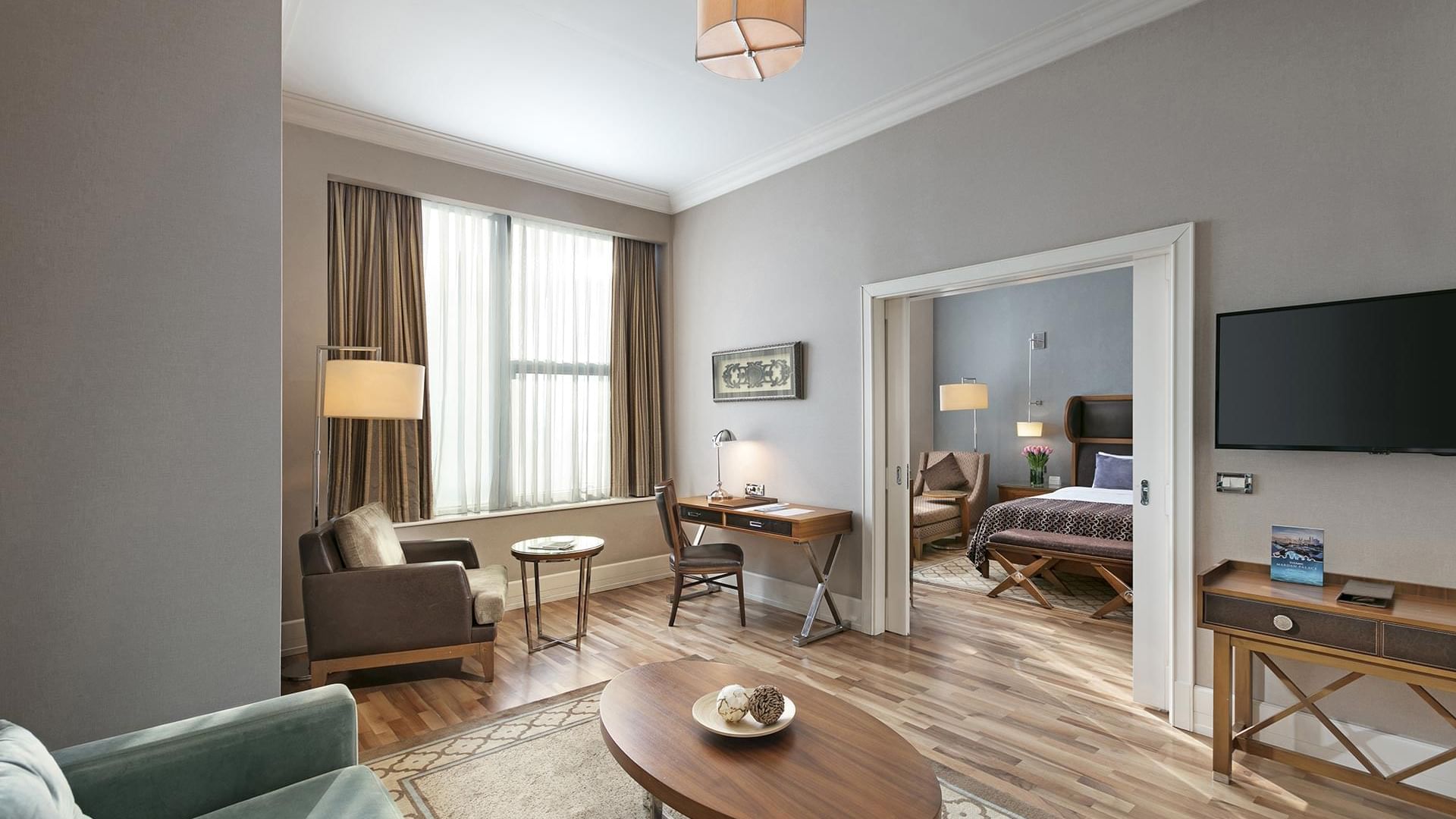 Spacious Premier Suite with living area and bedroom at Titanic Business Kartal in Istanbul.