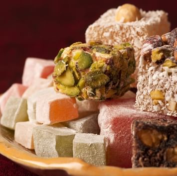 Close-up of Turkish sweets served on a dish in a restaurant near Titanic Business Kartal