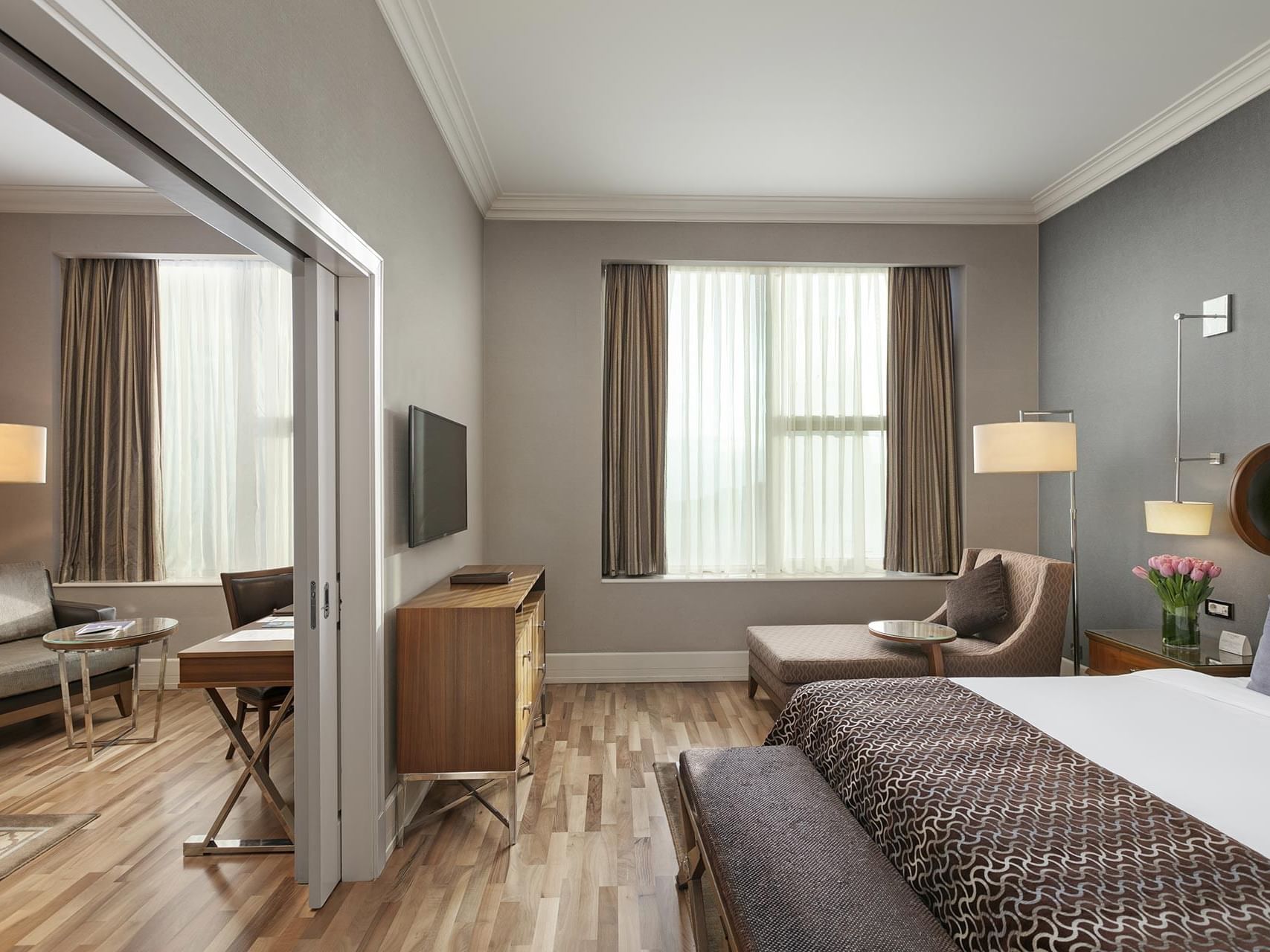 Comfy bed, single sofa with TV in Premier Suite at Titanic Business Kartal