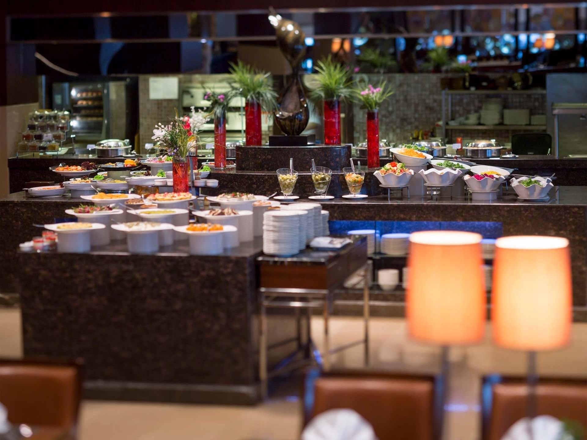 A luxurious buffet with assorted dishes and elegant decor at Titanic Business Kartal.