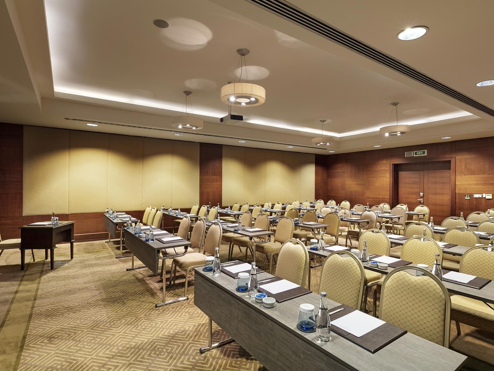 Classroom-typed meeting room arranged with tables and chairs in Azor at Titanic Business Kartal