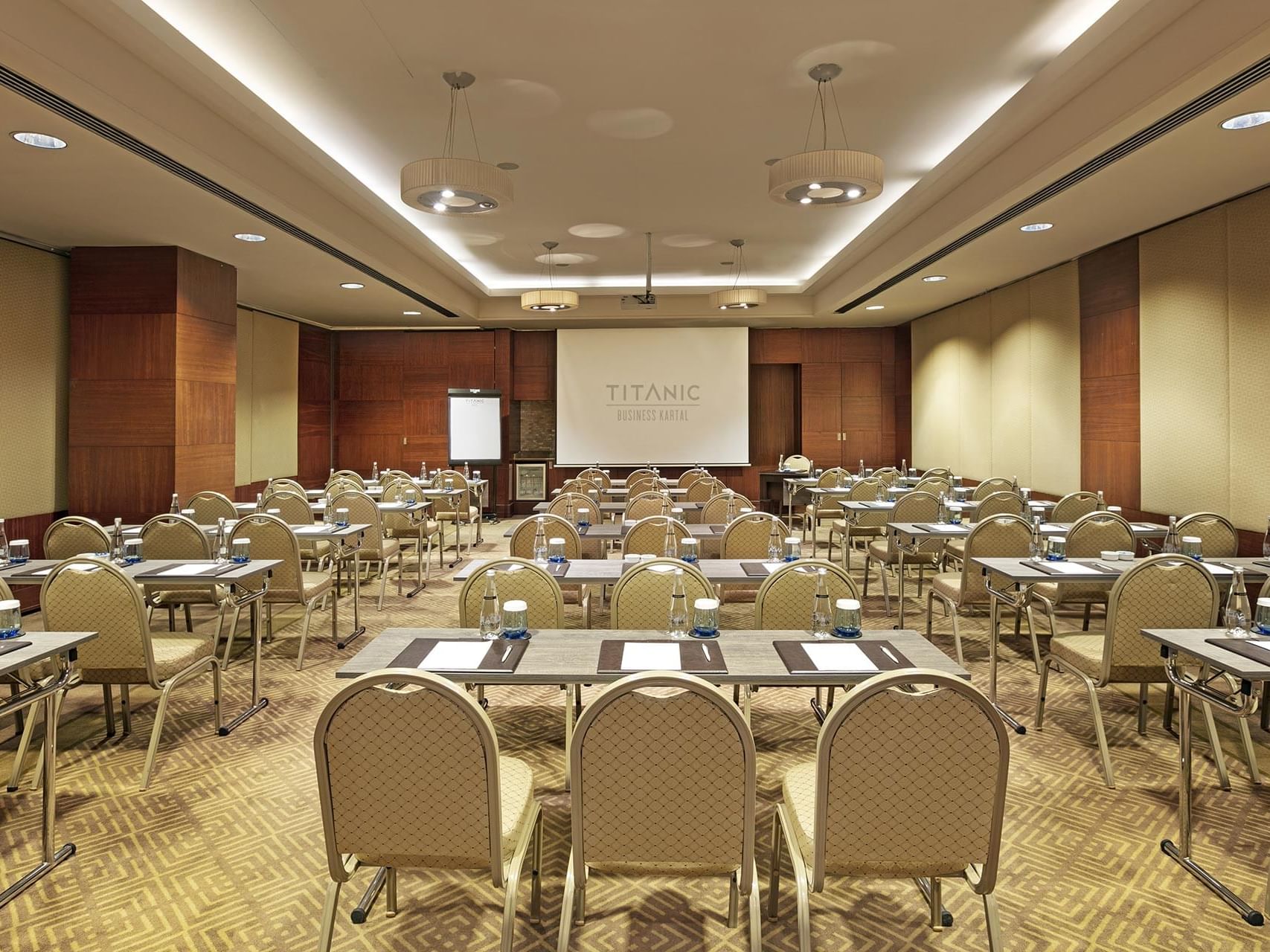 Classroom-typed meeting room arranged with tables and chairs in Azor at Titanic Business Kartal