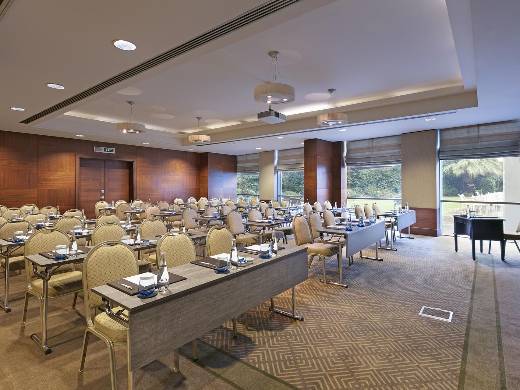 Classroom-typed meeting room arranged with tables and chairs in Azor at Titanic Business Kartal