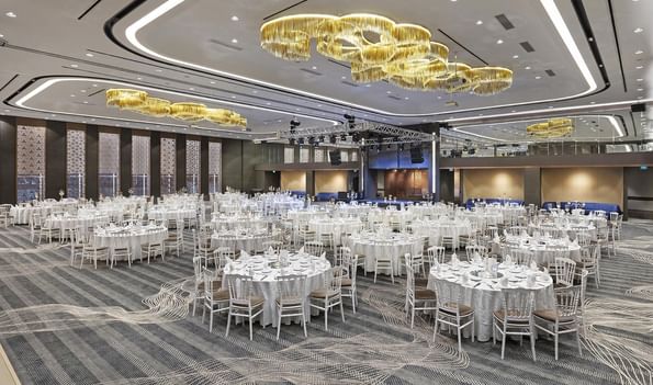 Karina 1+2 event room with large tables and chairs at Titanic Business Kartal in Istanbul.