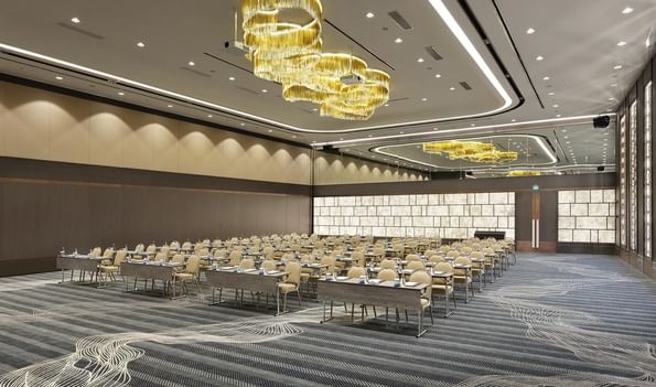 Spacious Karina 1 event room with elegant decor and large chandeliers at Titanic Business Kartal in Istanbul.