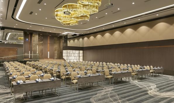 Karina 2 event room with modern decor and large chandelier at Titanic Business Kartal in Istanbul.