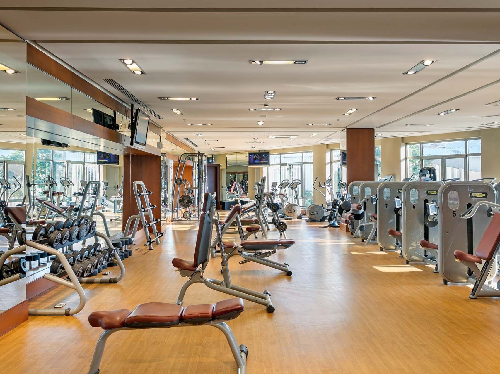 Modern gym with weight machines and equipment at Titanic Business Kartal.
