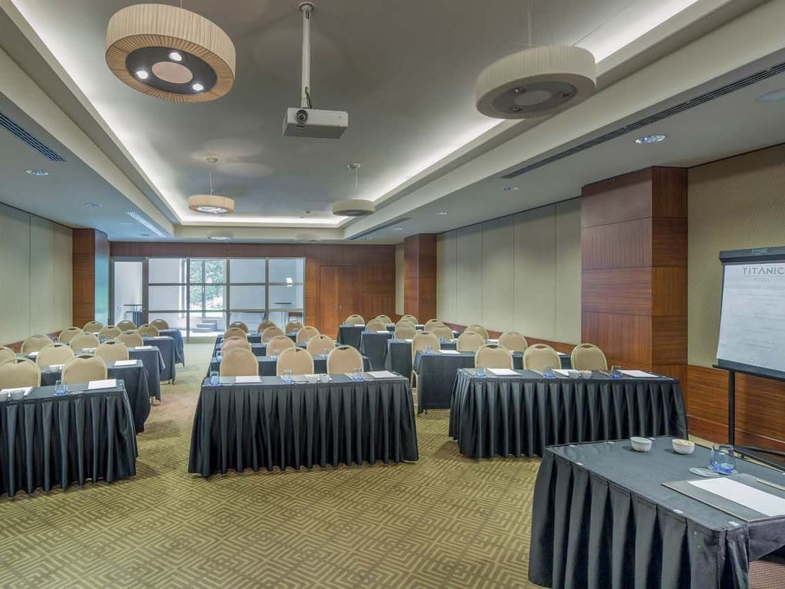 Meeting room setup with round tables at Titanic Business Kartal.