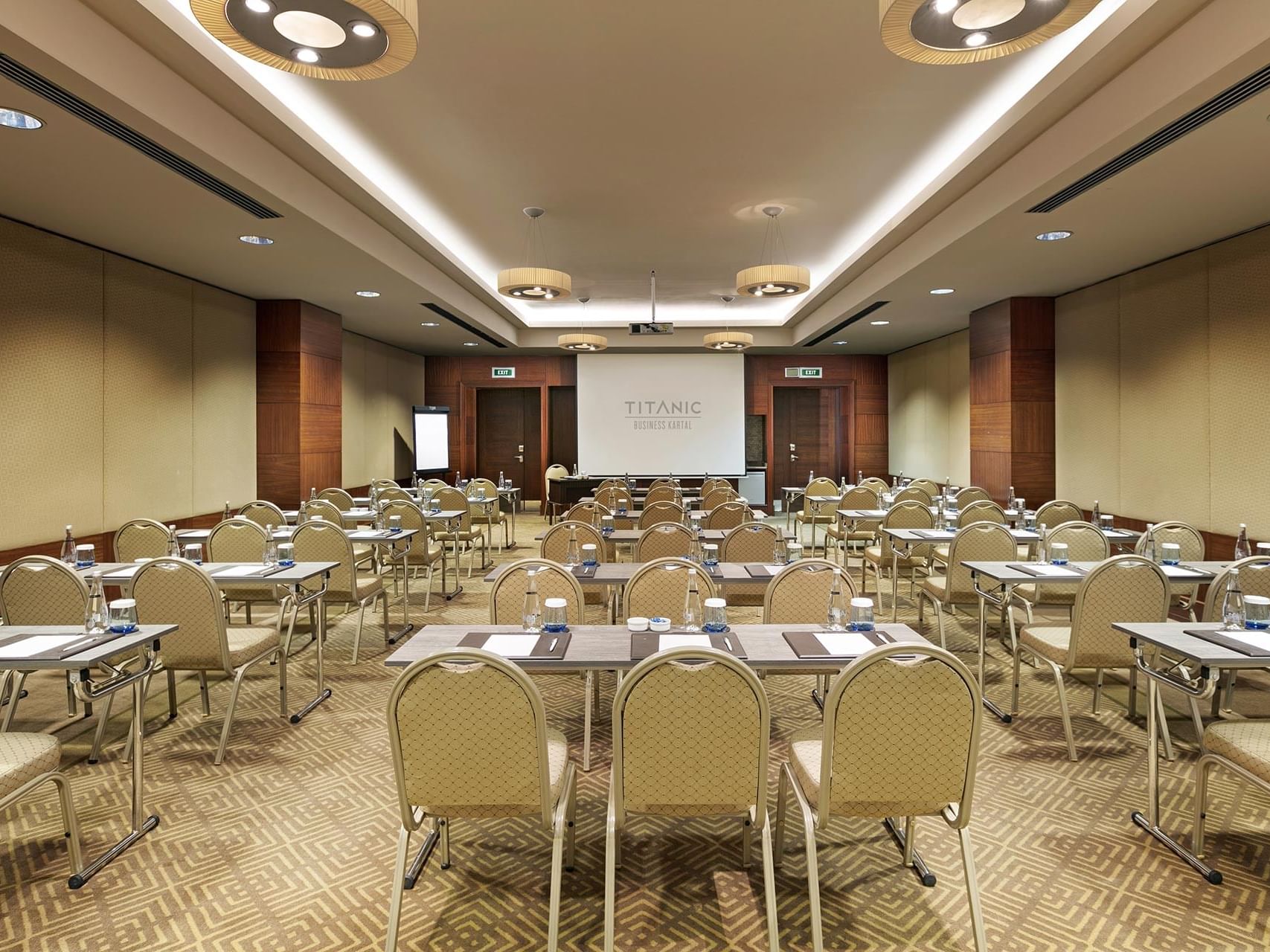 Classroom-typed meeting room arranged with tables and chairs in Borneo at Titanic Business Kartal