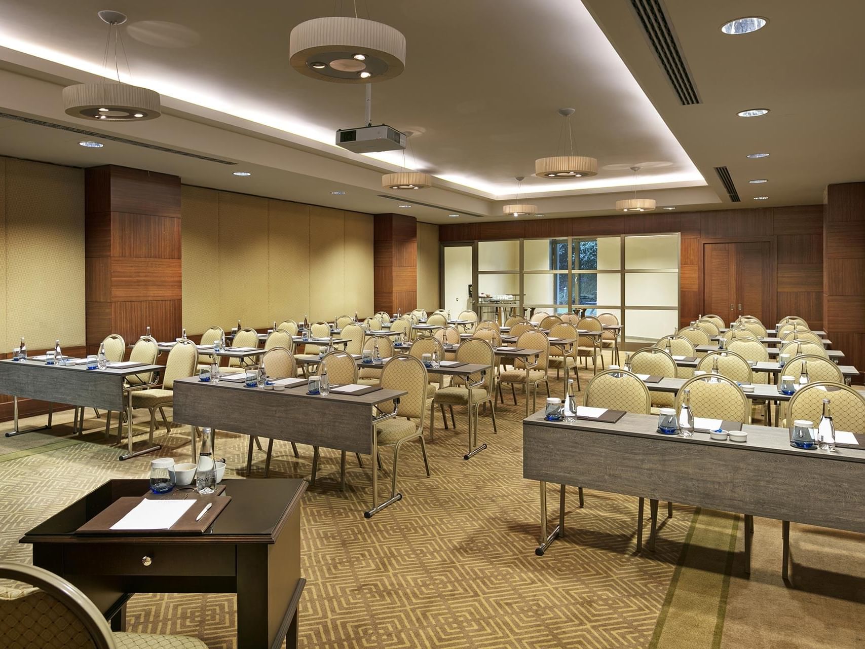 Classroom-typed meeting room arranged with tables and chairs in Borneo at Titanic Business Kartal