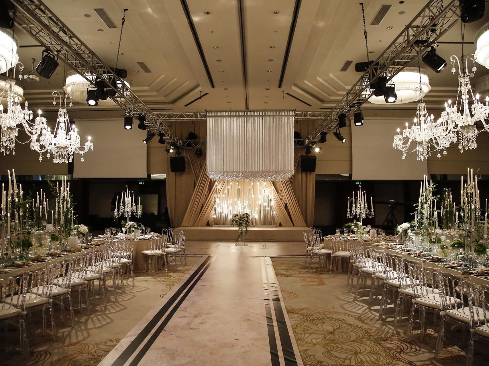 An elegant dining tables arranged with chairs for an event in Karina Ballroom at Titanic Business Kartal